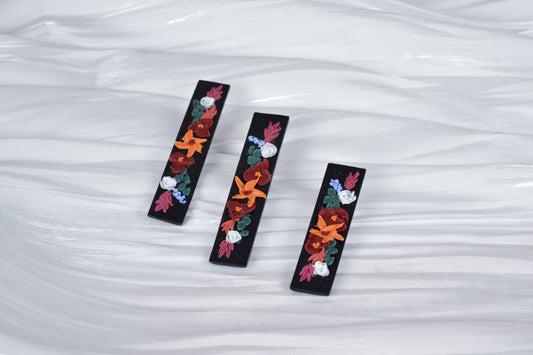 Haarspange in Schwarz mit Herbstblumen