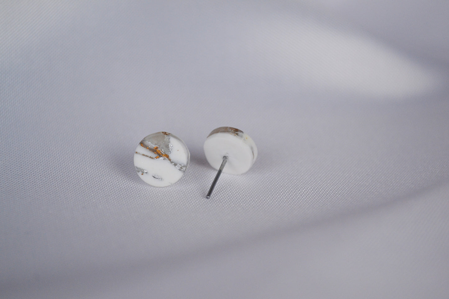 Sol stud earrings in white & metallic