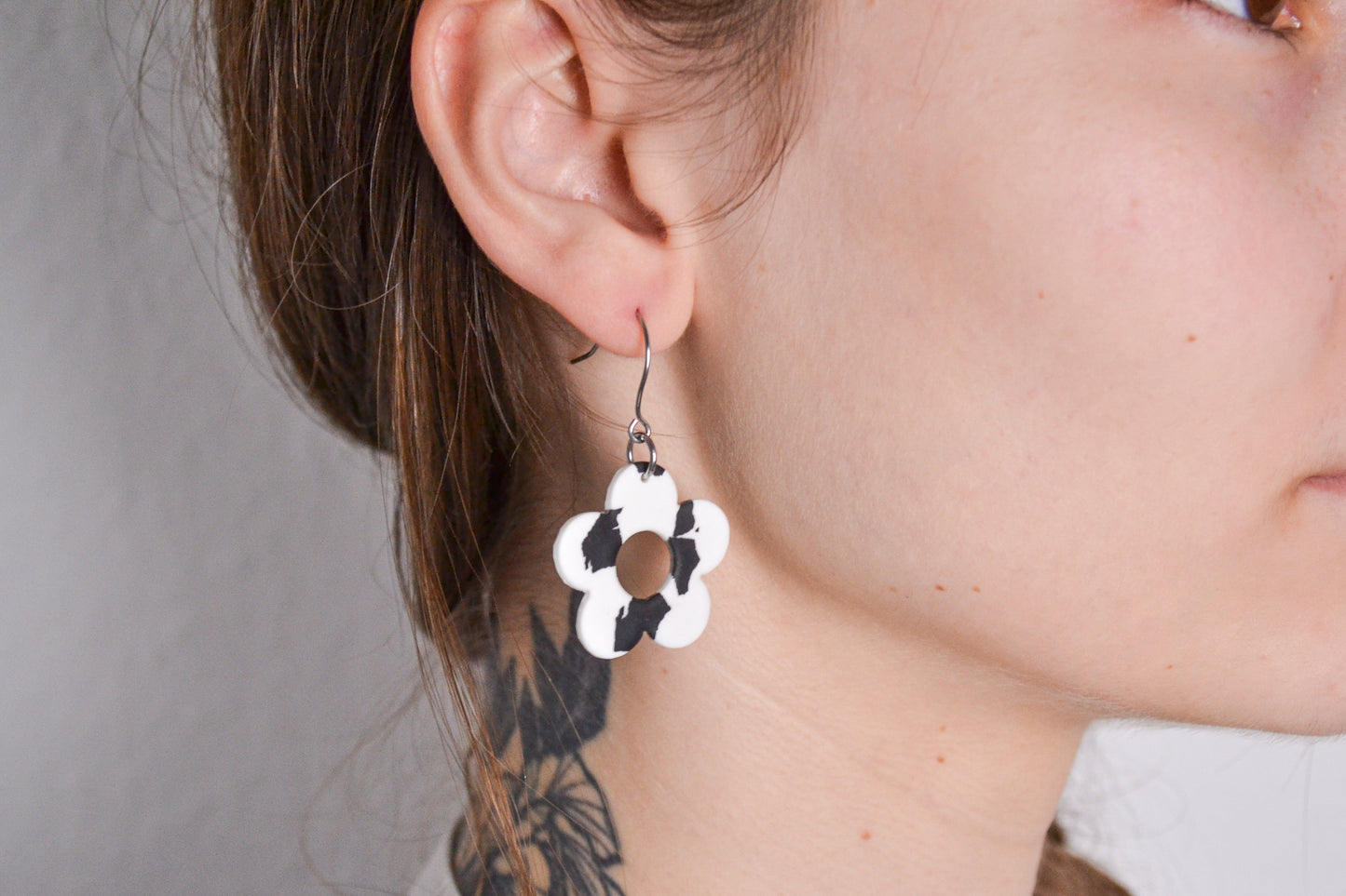 Flower earrings with cow pattern