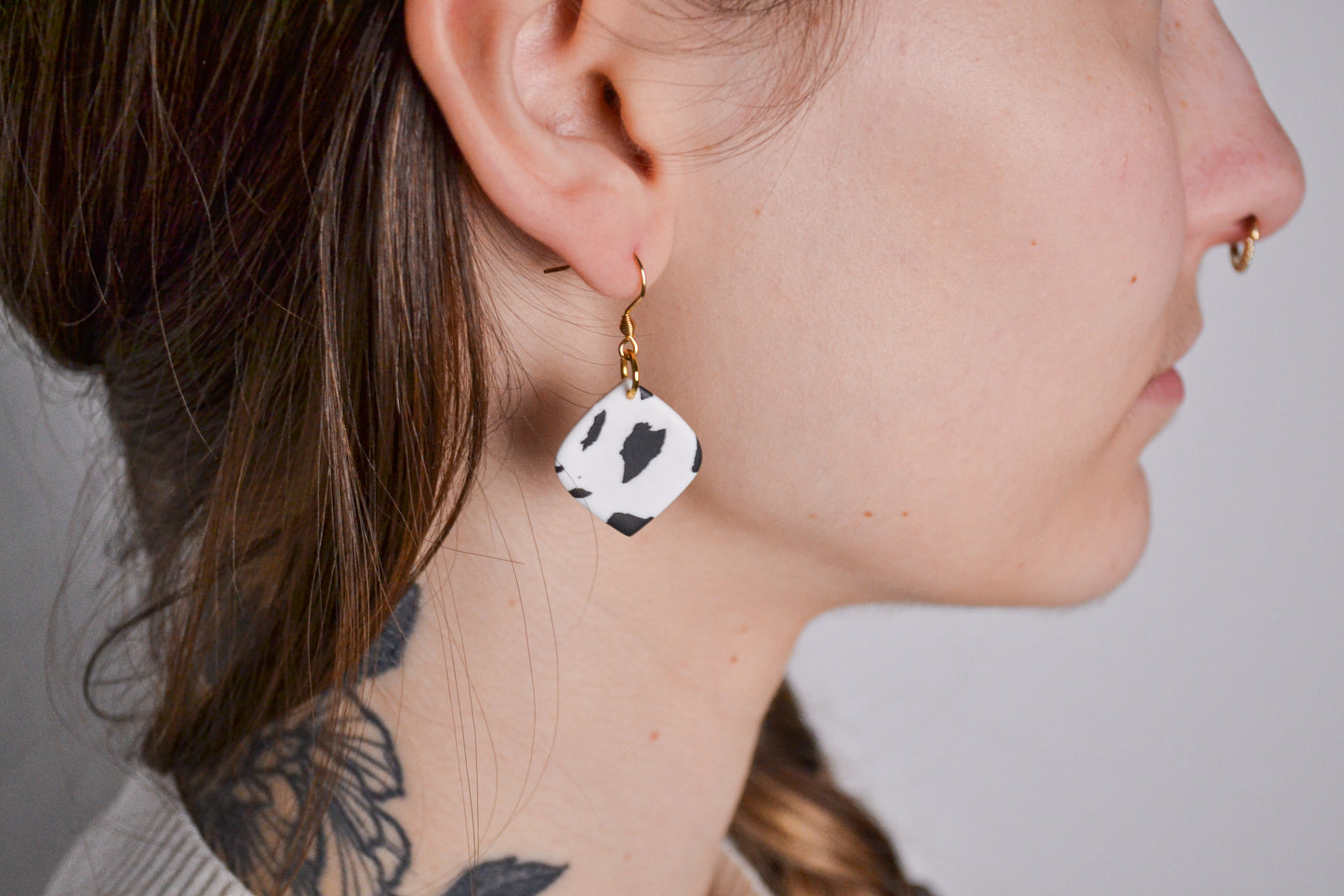 Mae earrings with cow print