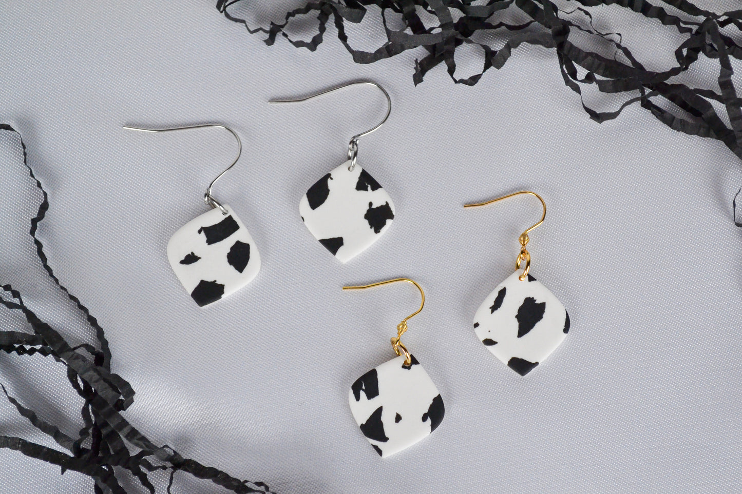 Mae earrings with cow print