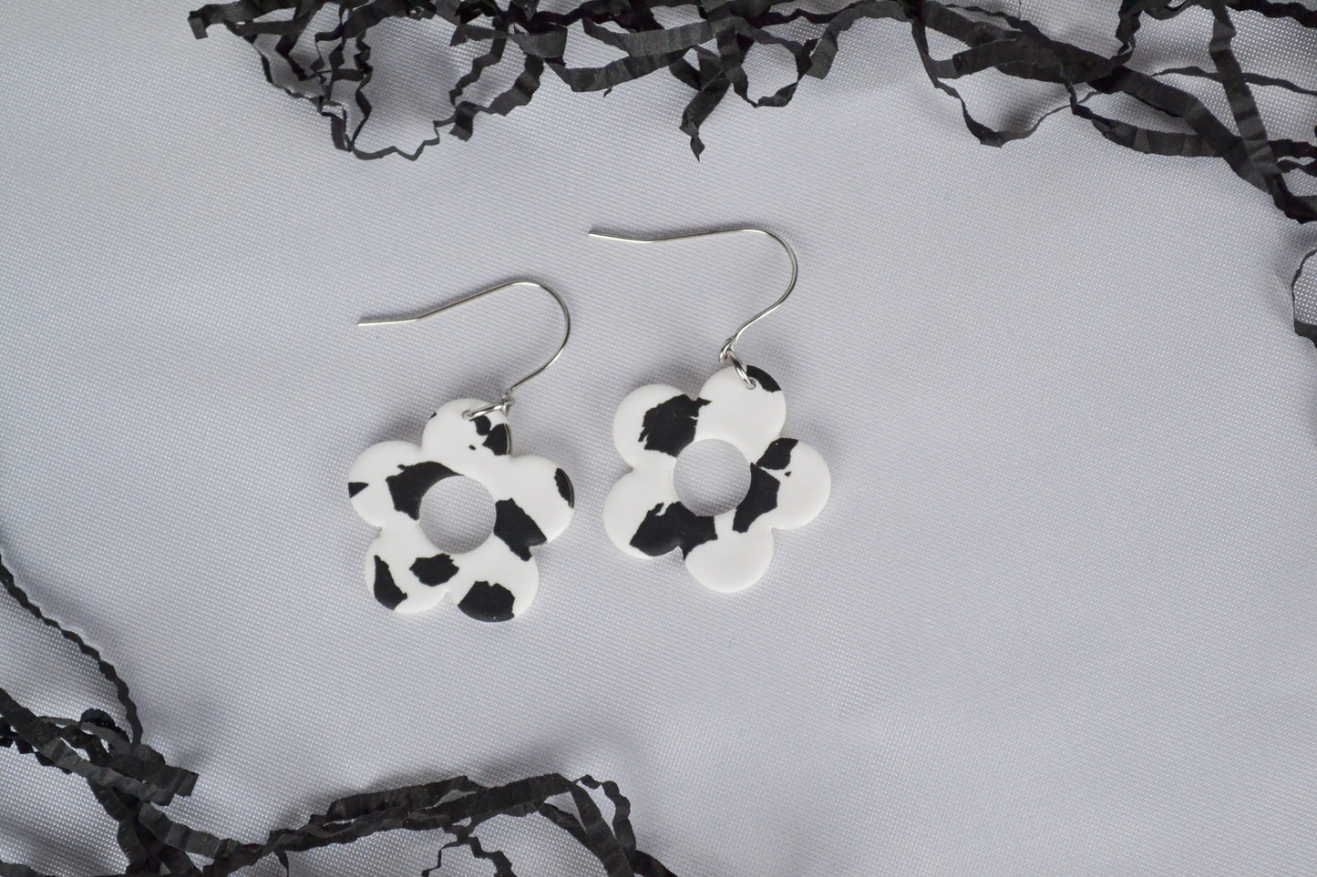 Flower earrings with cow pattern