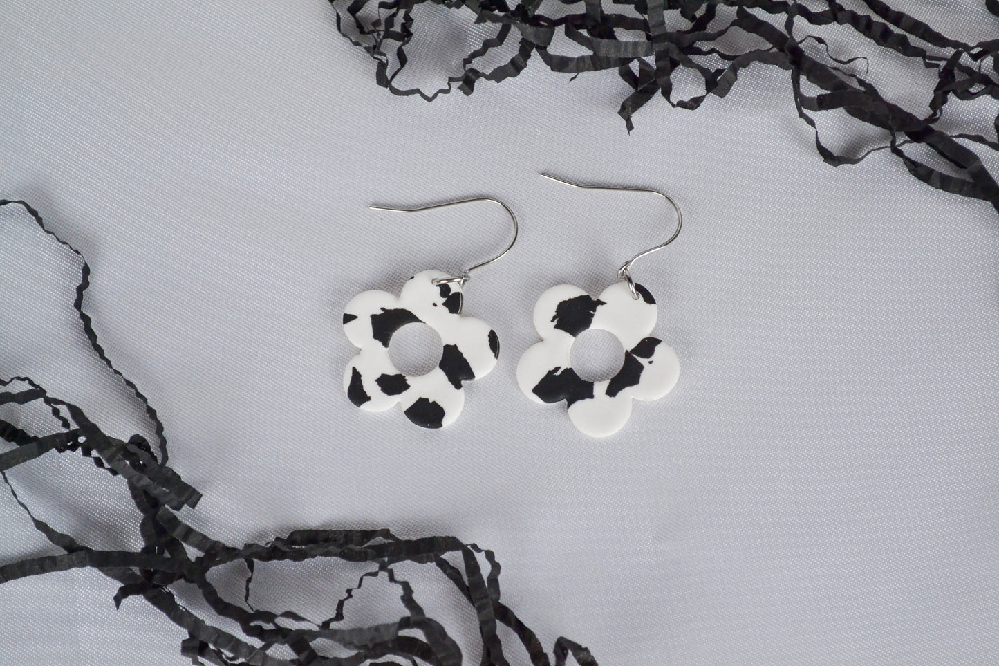 Flower earrings with cow pattern